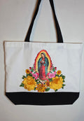 Our Lady Of Guadalupe image with 3D flower appliqués on a spacious, high-quality canvas tote bag.